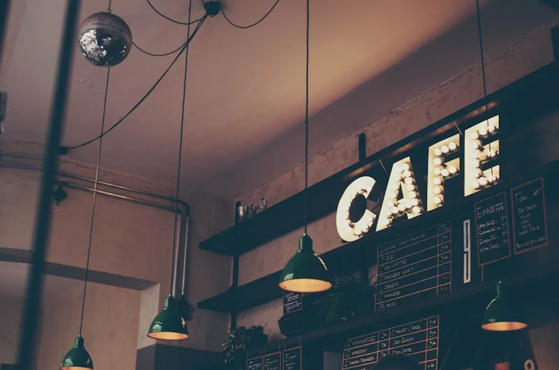 Cozy waterfront cafe interior with warm lighting